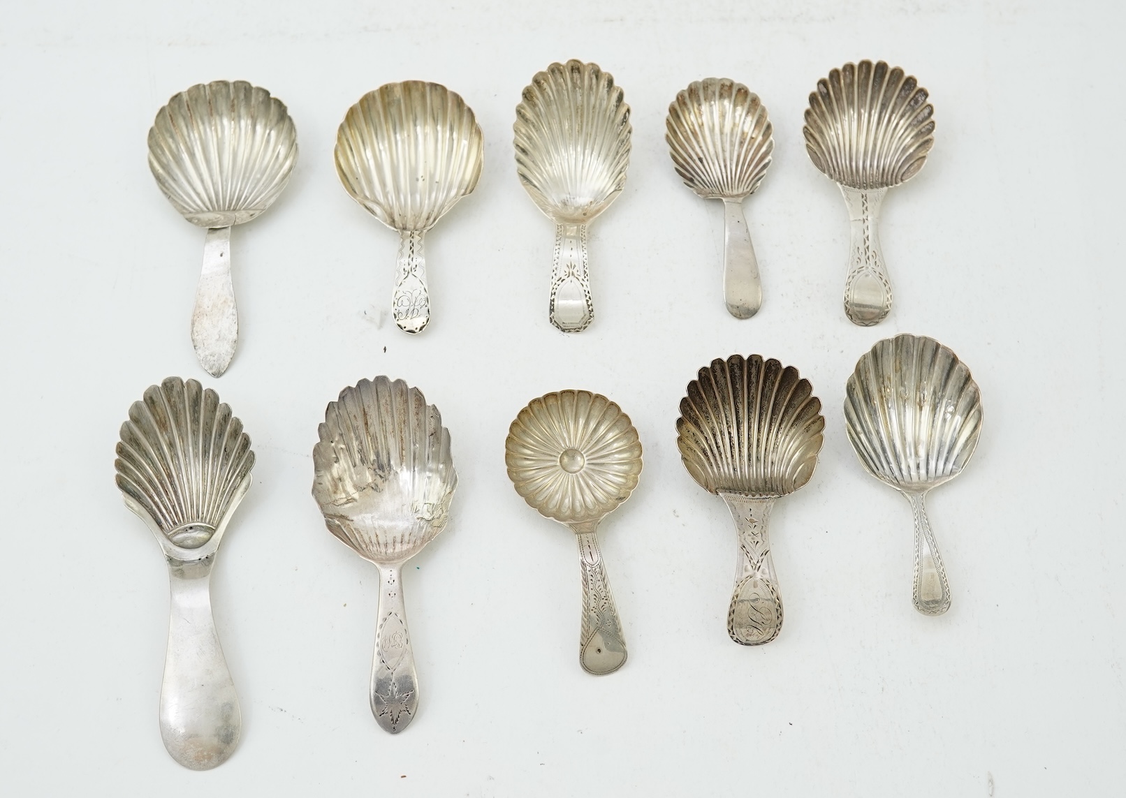 Ten assorted mainly 19th century silver and white metal caddy spoons, with shell or fluted bowls
